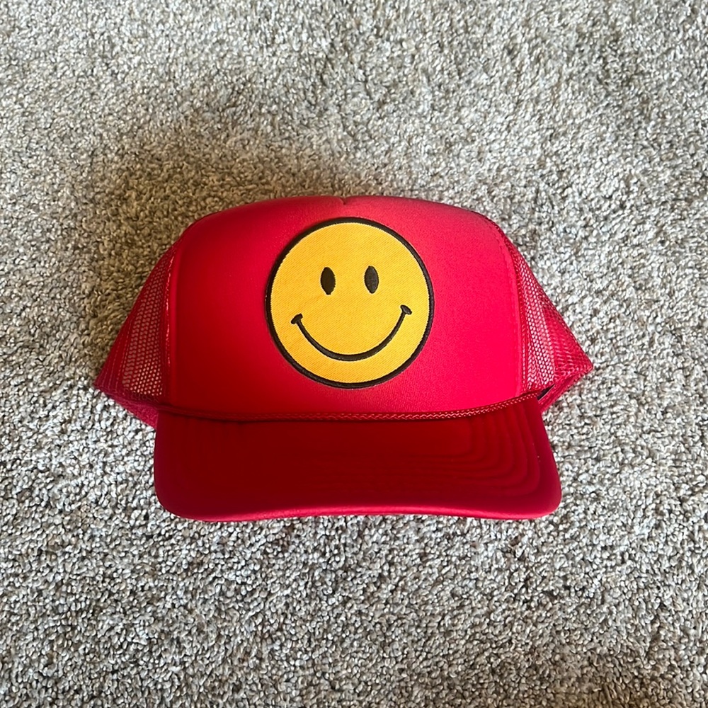 Red smiley trucker hat